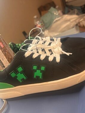 Black Sneakers with Green Pixel Character Accent